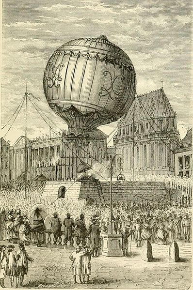 Malováné dobové zachycení horkovzdušného balónu bratrů Montgolfierových na náměstí